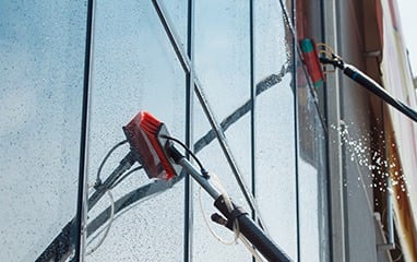 Commercial window cleaning being carried out on an exterior facade