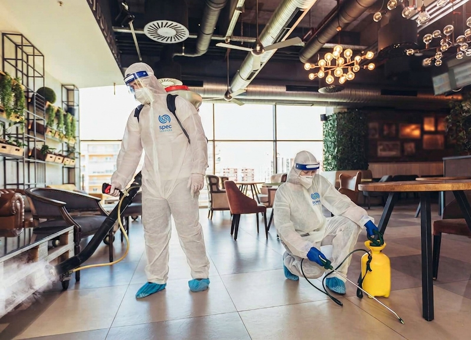 Commercial restaurant cleaners at work in a kitchen