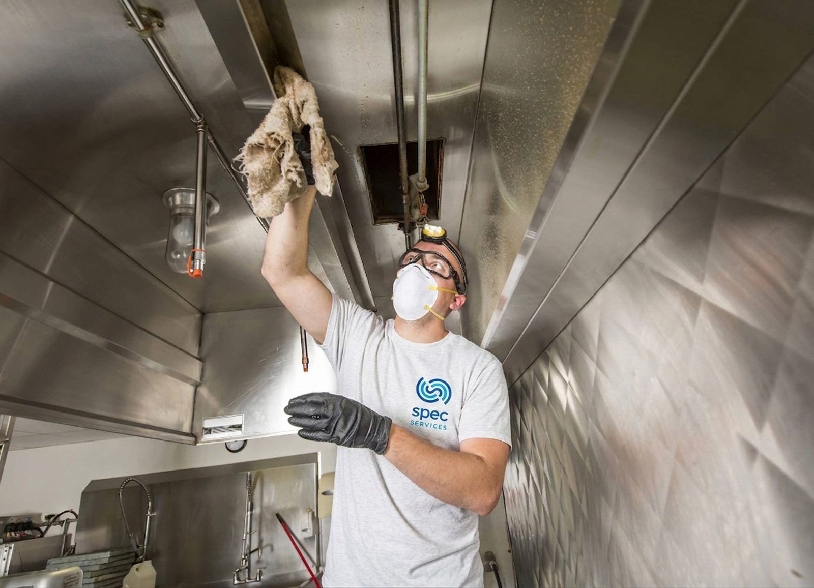 Commercial kitchen cleaning in progress inside a restaurant
