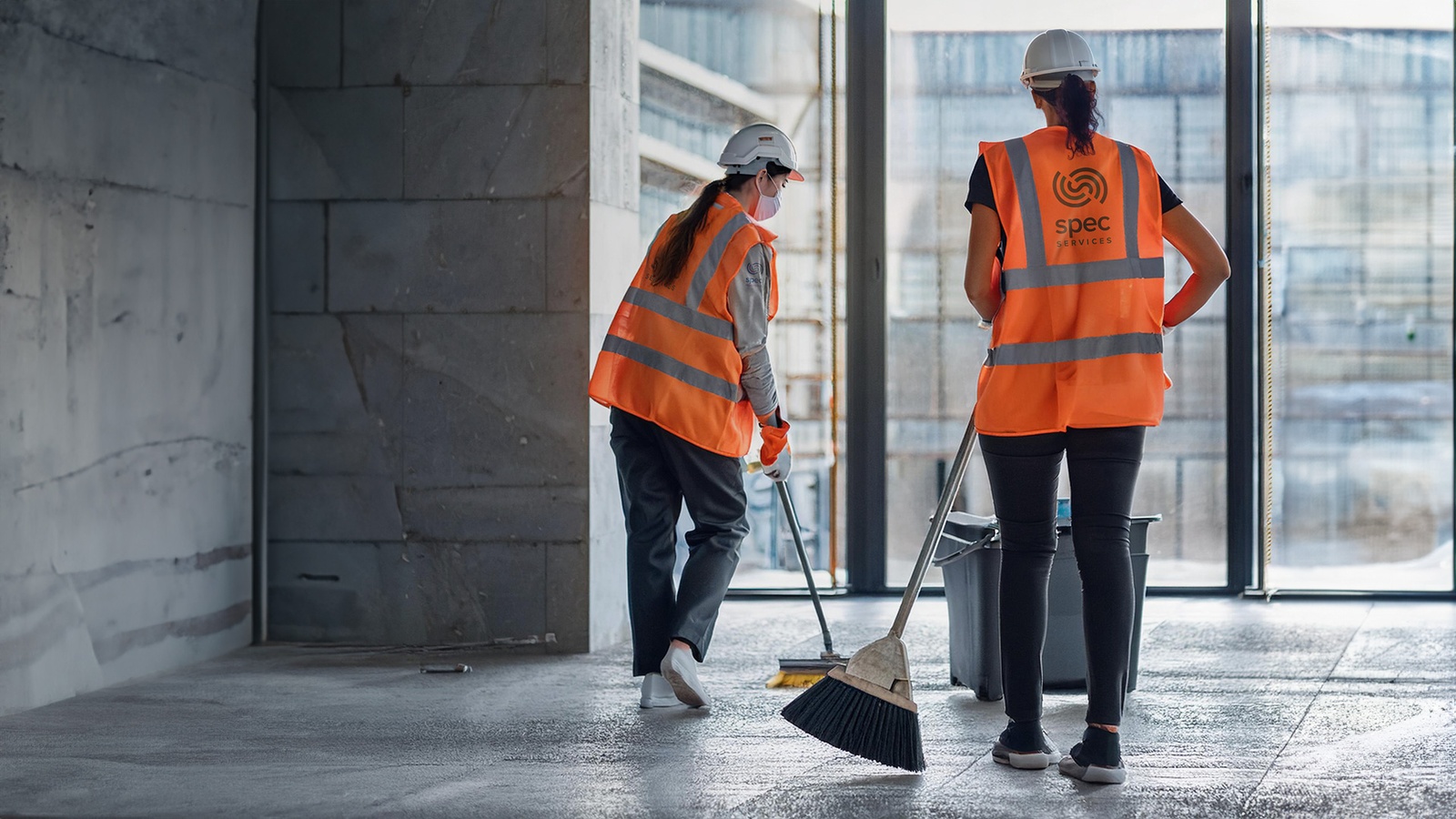 Indoor sweeping and floor cleanup on a construction site